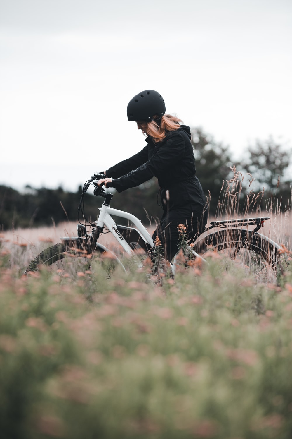 A woman riding an e-bike for a commute