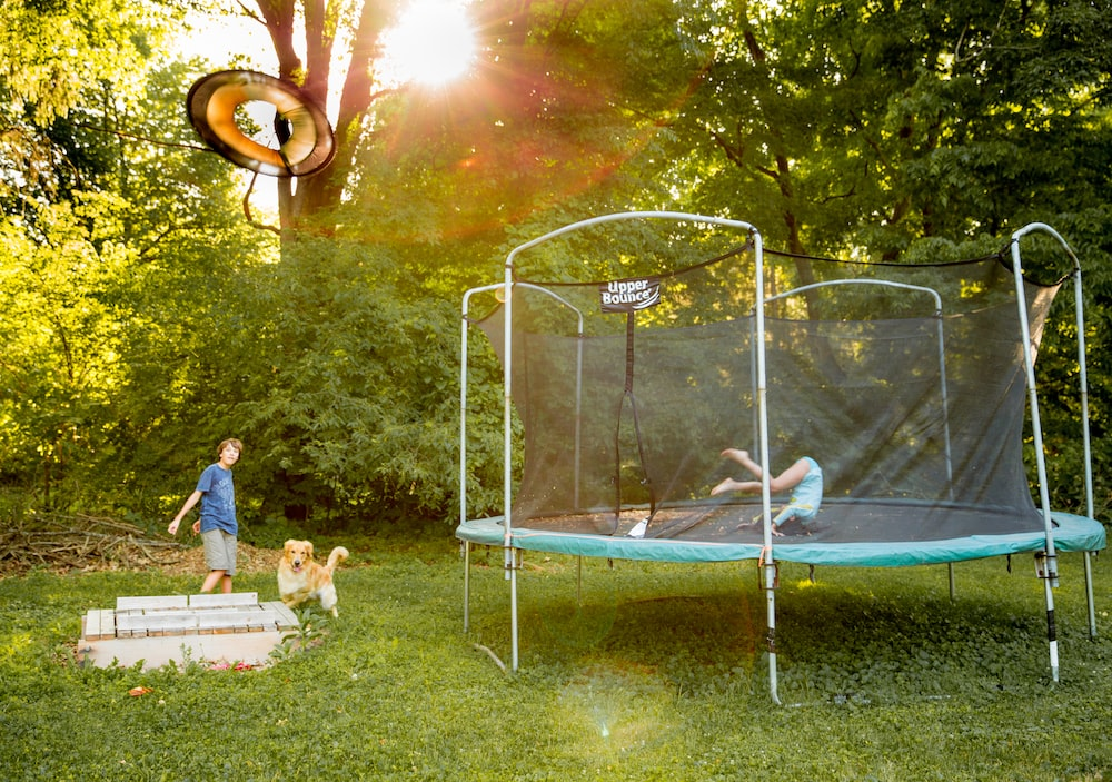 Trampoline with a safety enclosure